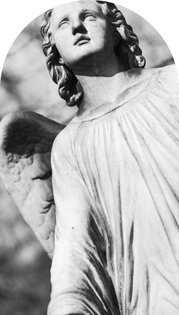 Marble angel statue with open arms looking upward