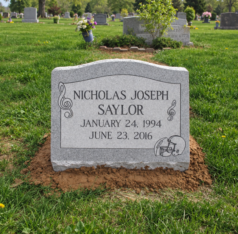 Grey granite slant marker for Nicholas Joseph Saylor with music and football engravings